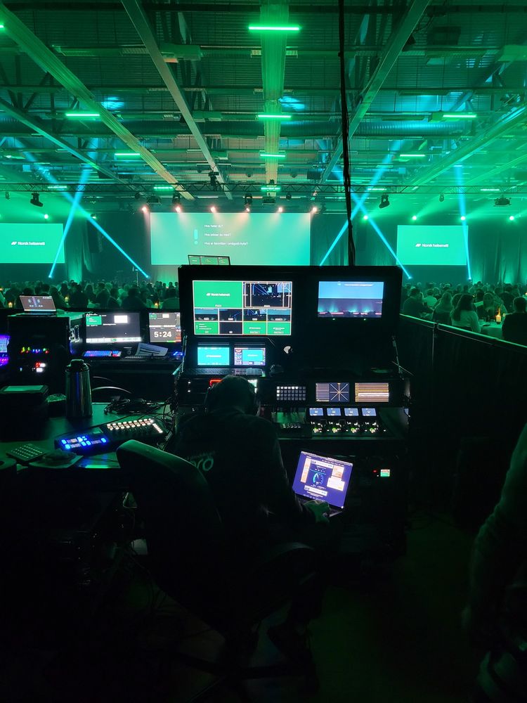 The control desk at a large event in green light